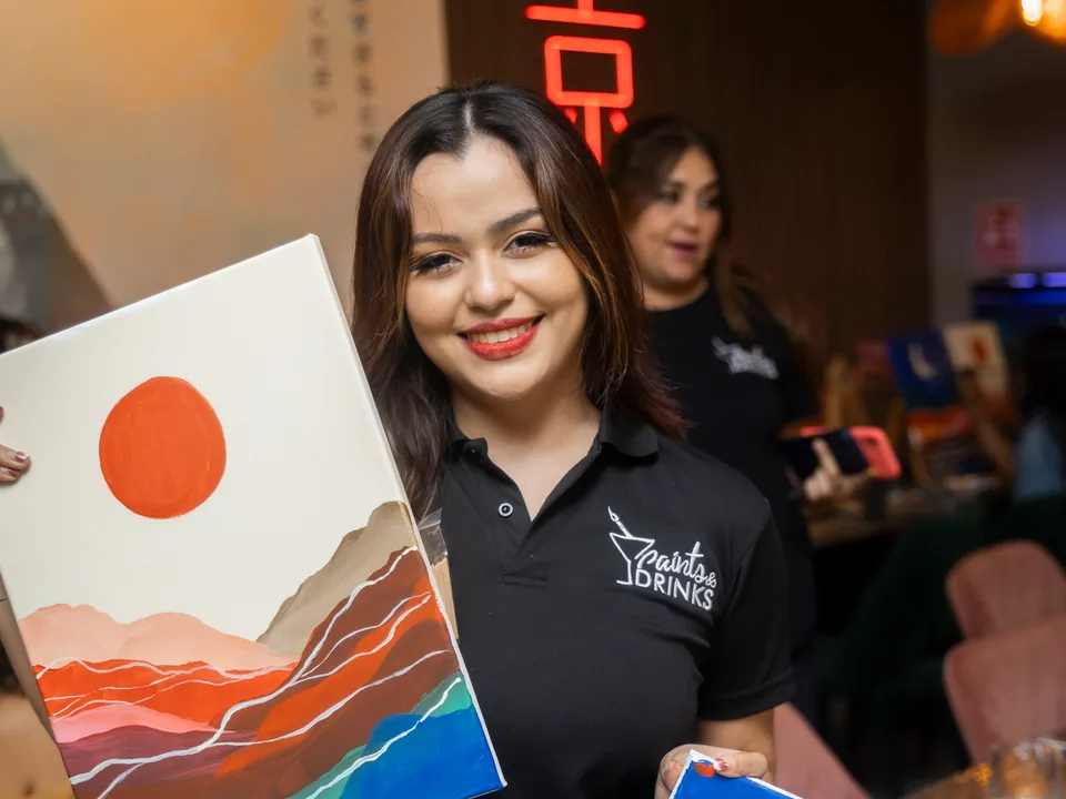 Someone gifting a Paints & Drinks painting experience